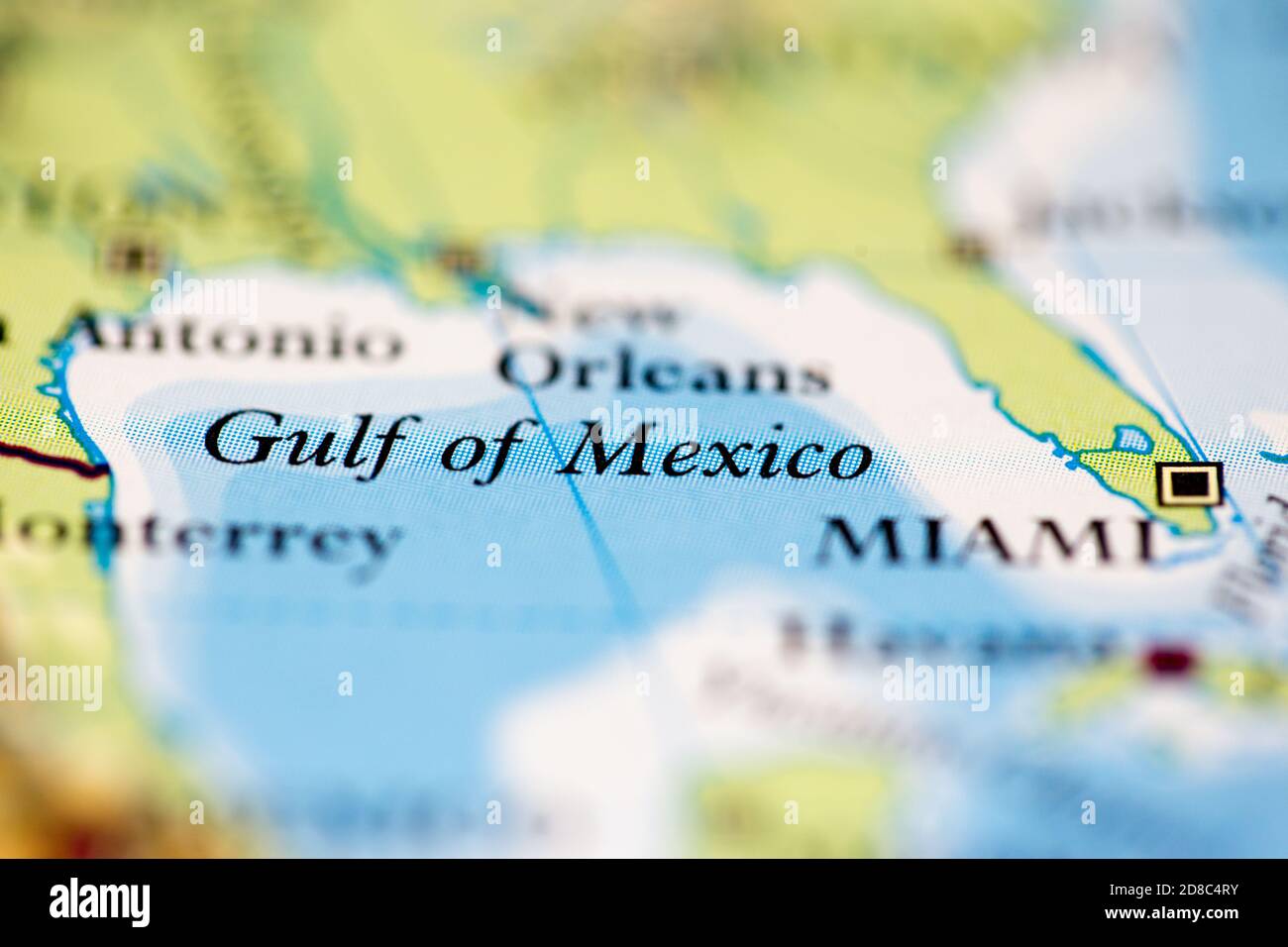 Shallow depth of field focus on geographical map location of Gulf of Mexico off coast of Mexico on atlas Stock Photo
