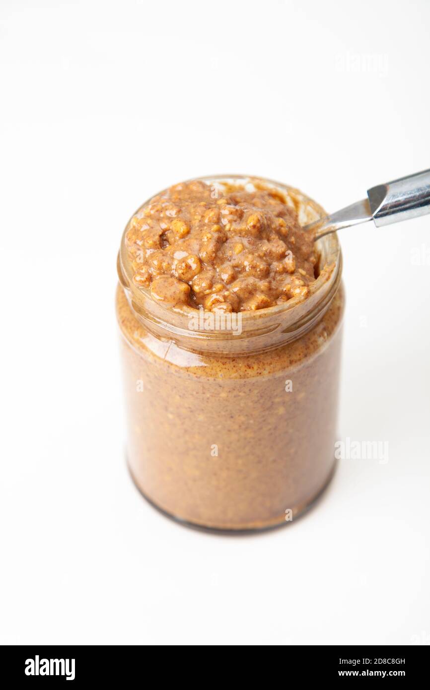 An open jar of crunchy peanut butter Stock Photo Alamy