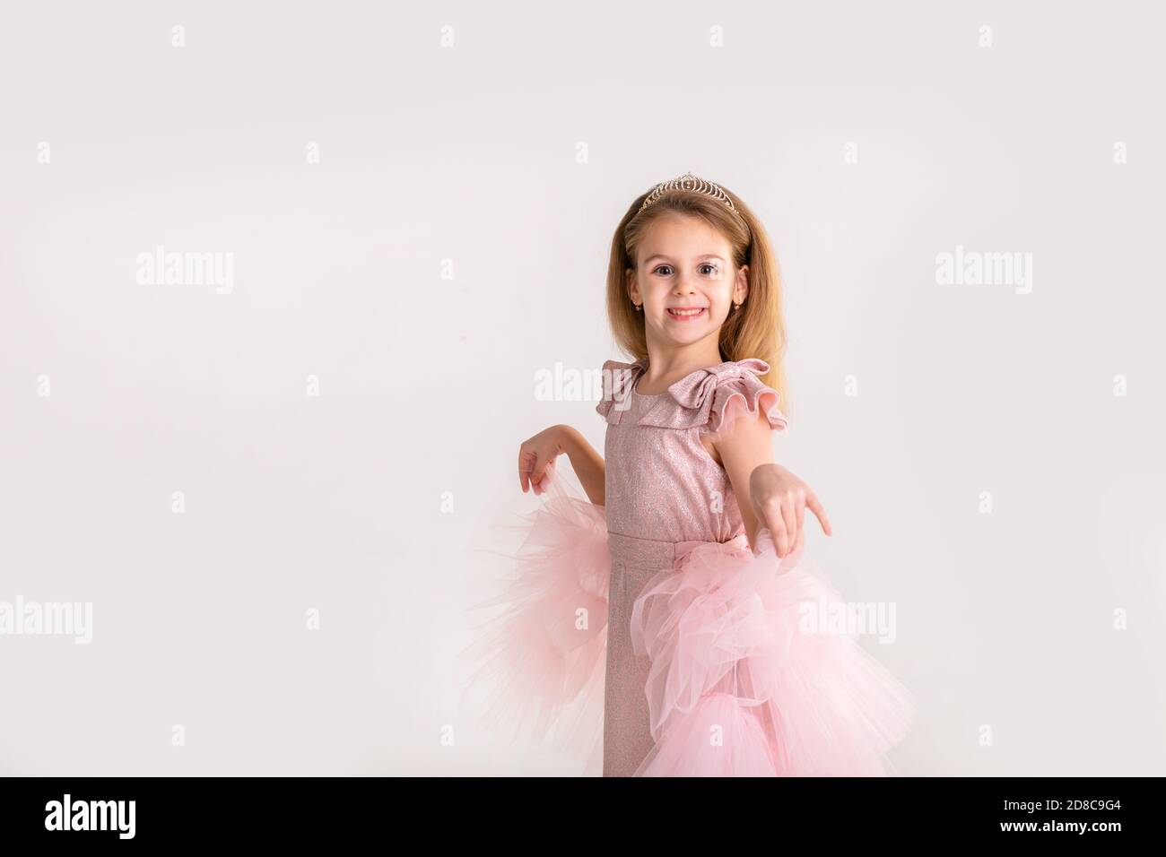 Beautiful little princess dancing in luxury dress Stock Photo - Alamy
