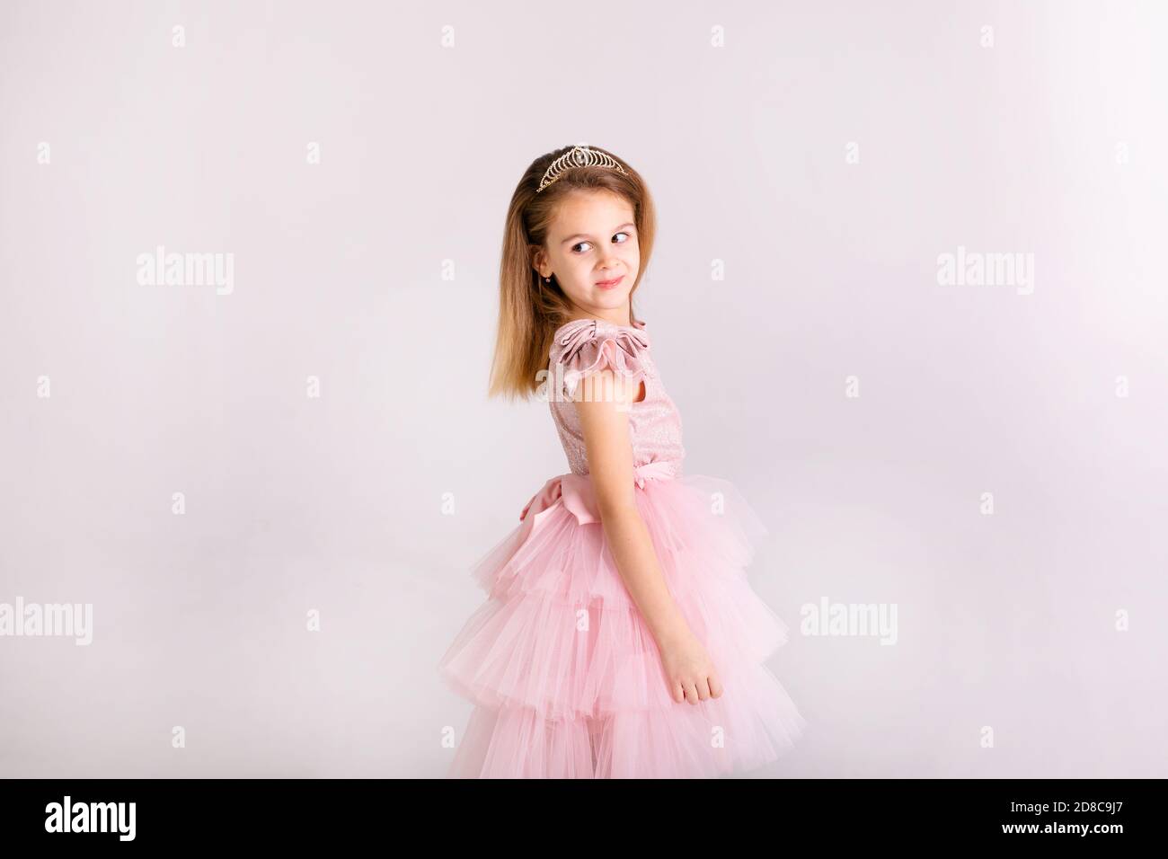 Beautiful little princess dancing in luxury dress Stock Photo - Alamy