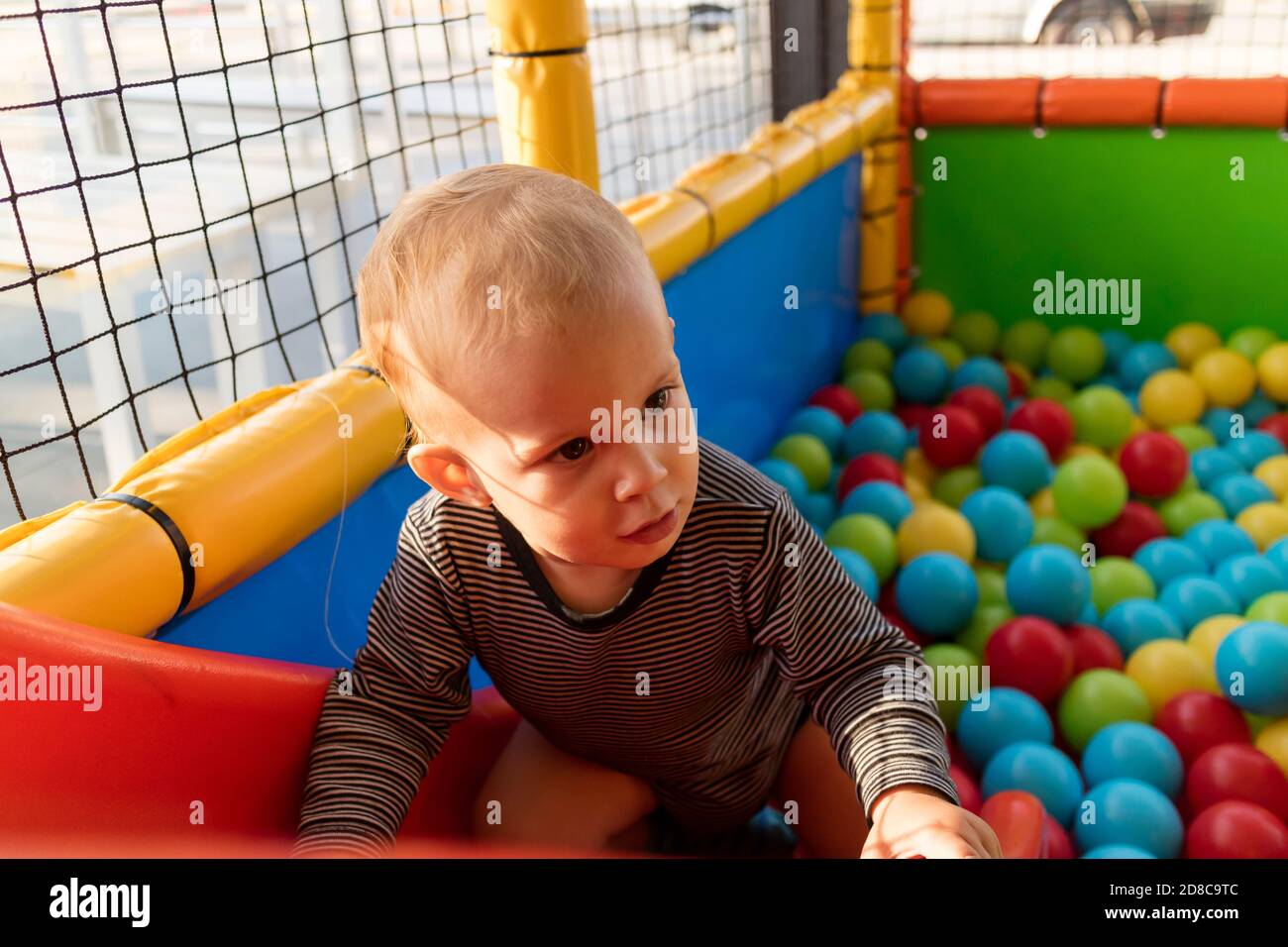 Baby Playing In Playground with Colorful Ball Stock Photo Alamy