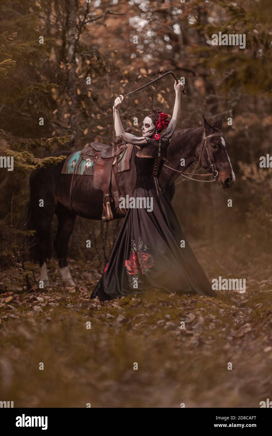 rancho gordo fully dressed in leather standing in the dust under the burning sun