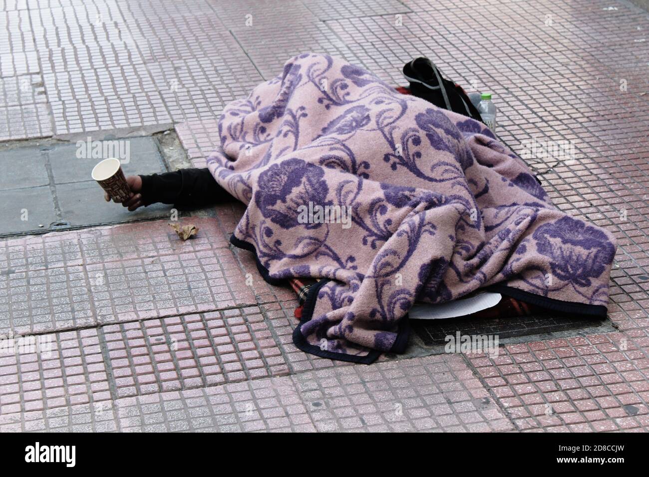 Greece, Athens, February 1 2020 - An unidentified homeless person begging for money in the center of Athens. Stock Photo