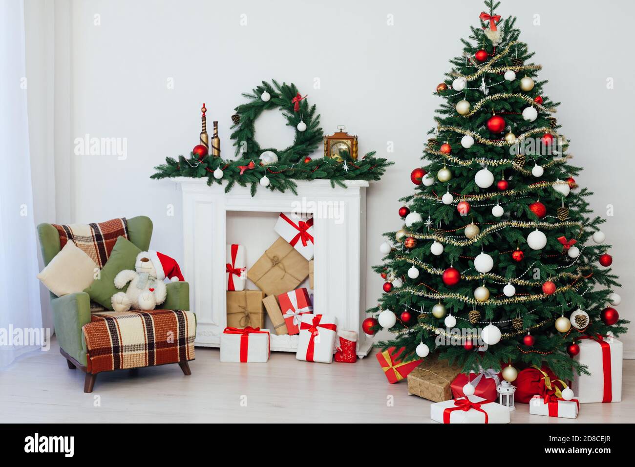 Christmas At M 2022 Christmas Tree With Gifts By The Fireplace For The New Year Decor Of The  House 2021 2022 Stock Photo - Alamy