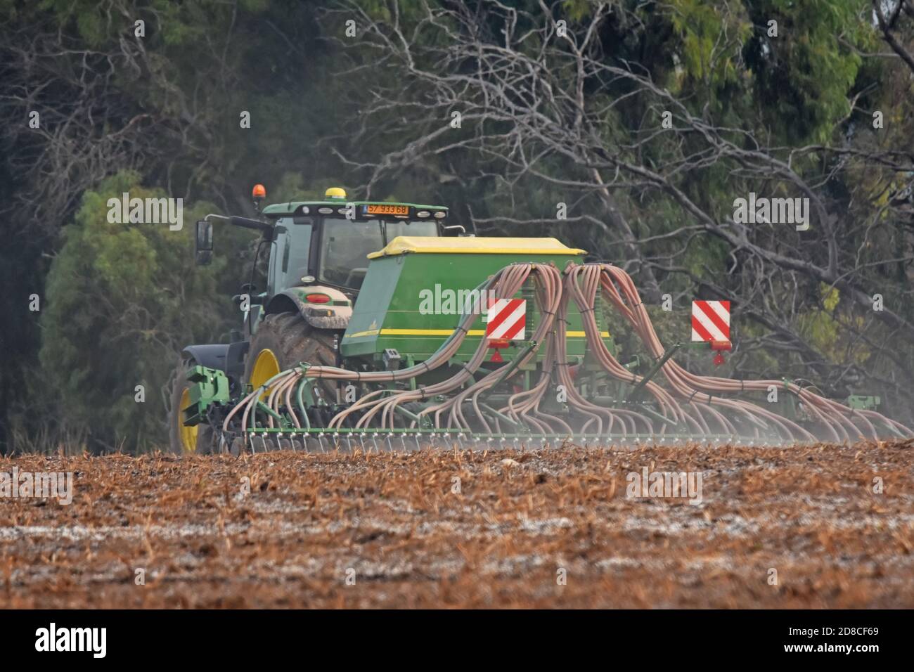 Tractor planting seeds the ground Stock Photo Alamy