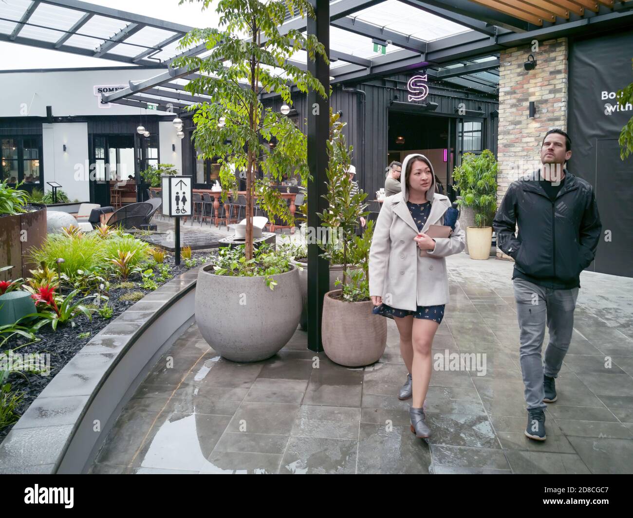 AUCKLAND, NEW ZEALAND - Oct 10, 2019: View of couple walking on rooftop dining and entertainment precinct terrace in Westfield Newmarket Shopping Cent Stock Photo