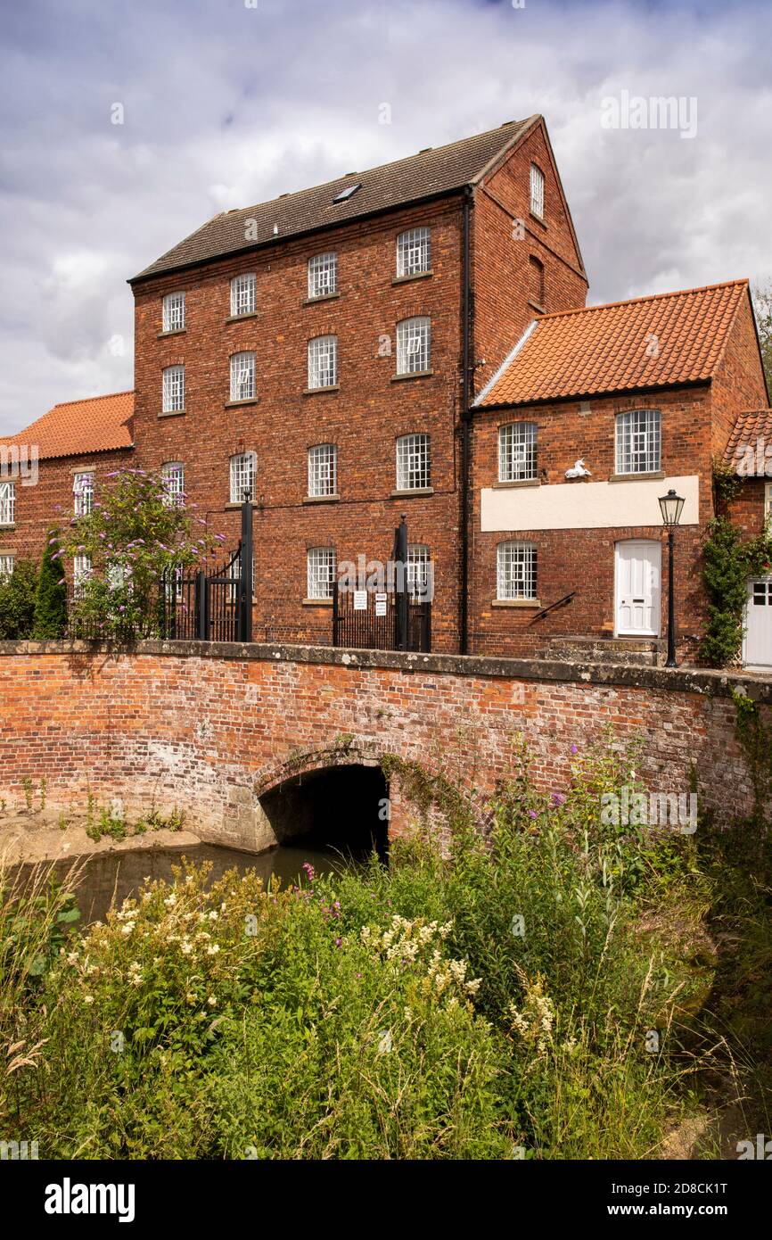 UK, England, Lincolnshire Wolds, Market Rasen, George Street, converted four storey water powered mill over River Rase Stock Photo