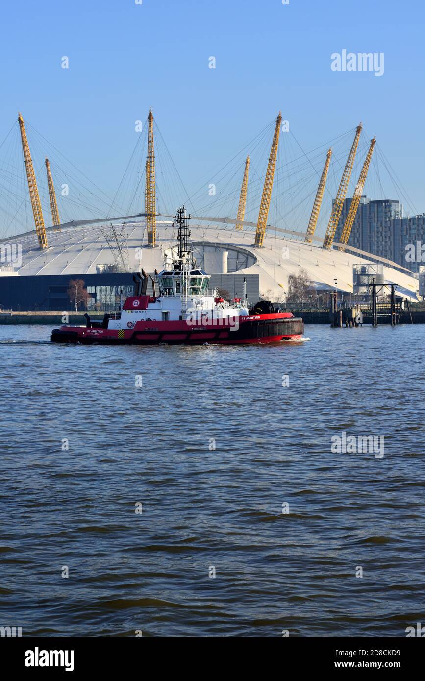 Thames river Tug boat passing the O2 Arena, East London, United Kingdom Stock Photo