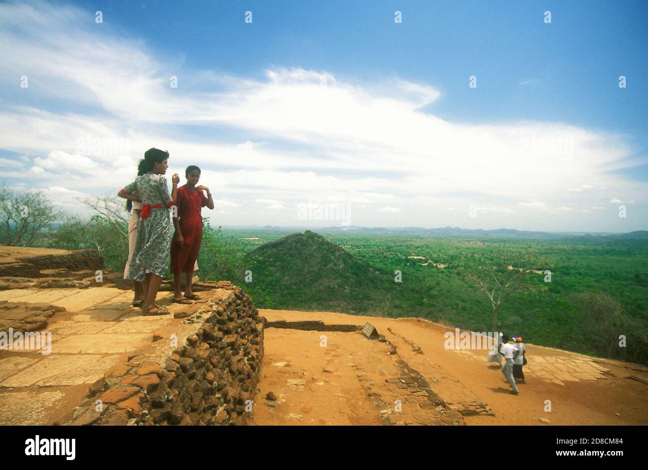 Women enjoying the panoramic view from the top of the rock outcrop of