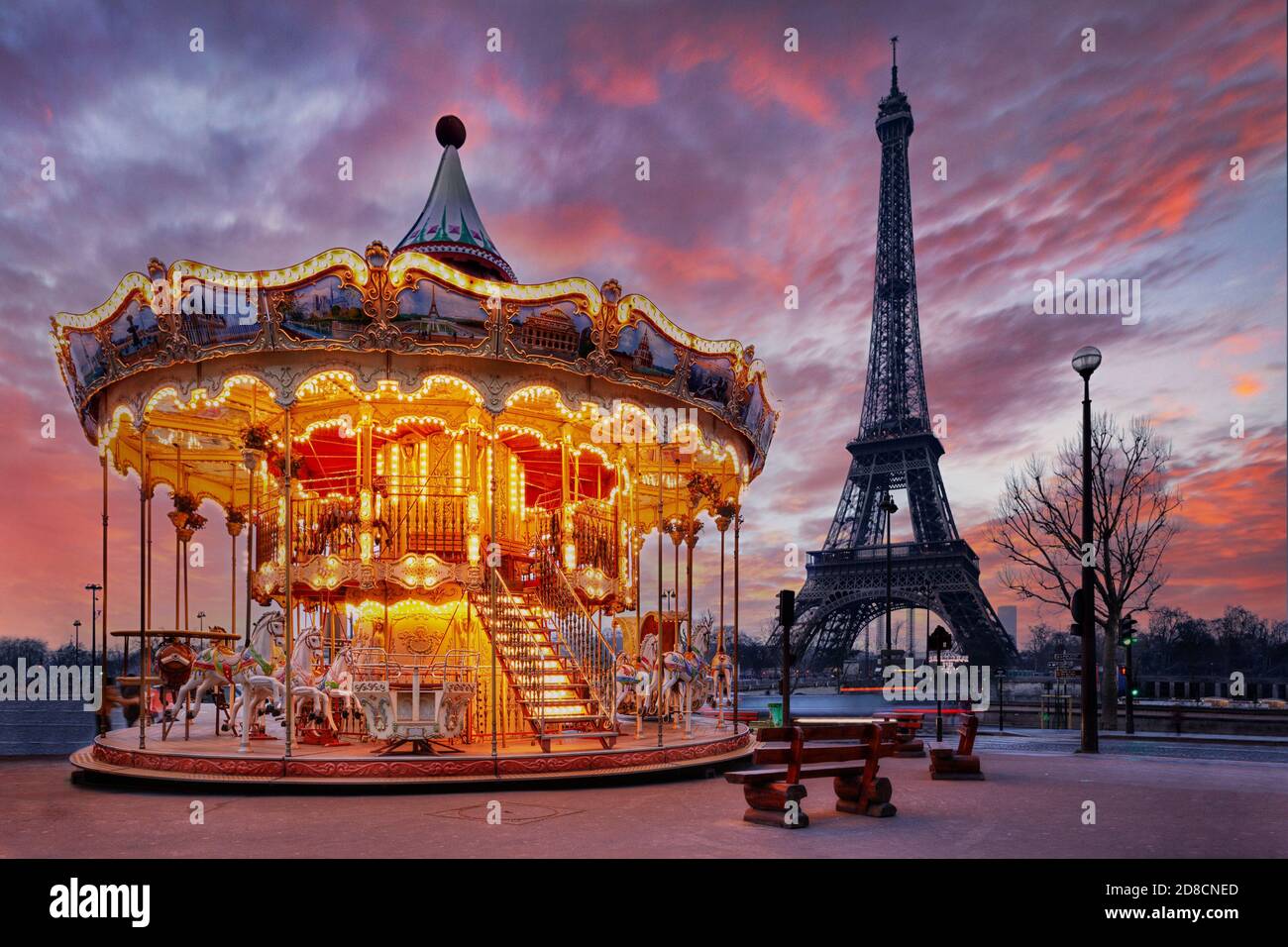 sunset over vintage carousel close to Eiffel Tower, Paris Stock Photo