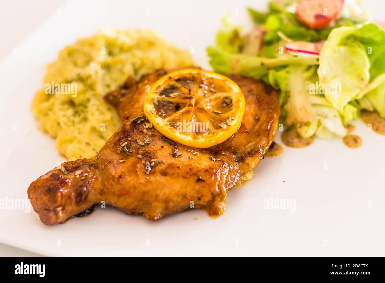 grilled lemon paprika chicken chop served with mashed potato and mixed