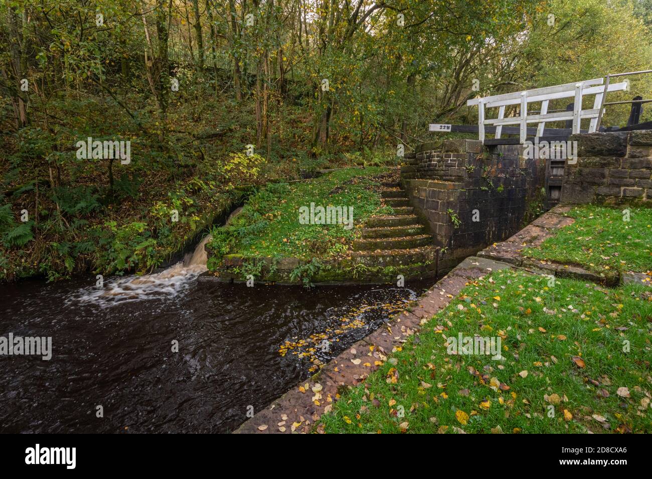 Autumn colours. Lock by Uppermill viaduct on the Huddersfield Narrow Canal Uppermill to Dobcross section, Saddleworth, Oldham, England, UK Stock Photo