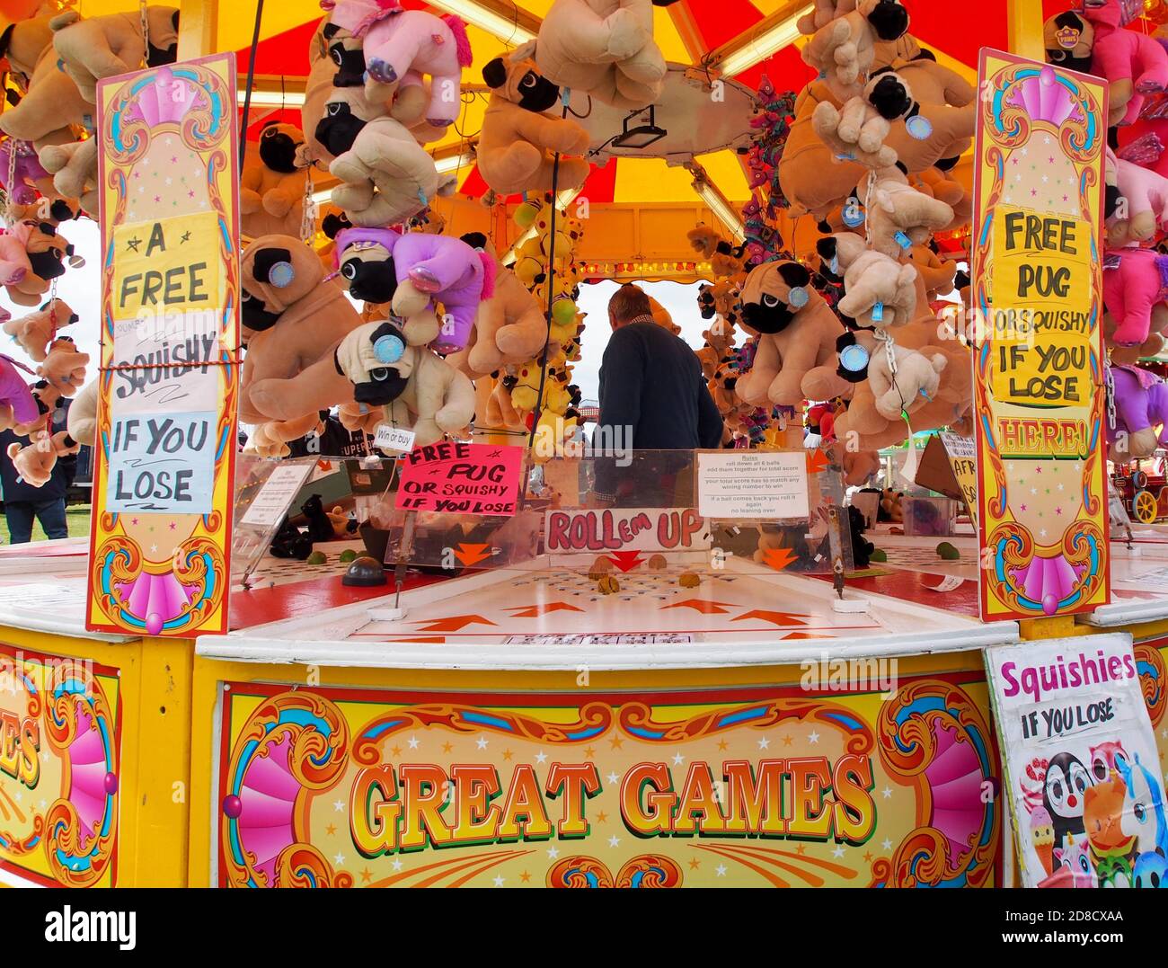 Game stalls and prizes at a fairground Stock Photo