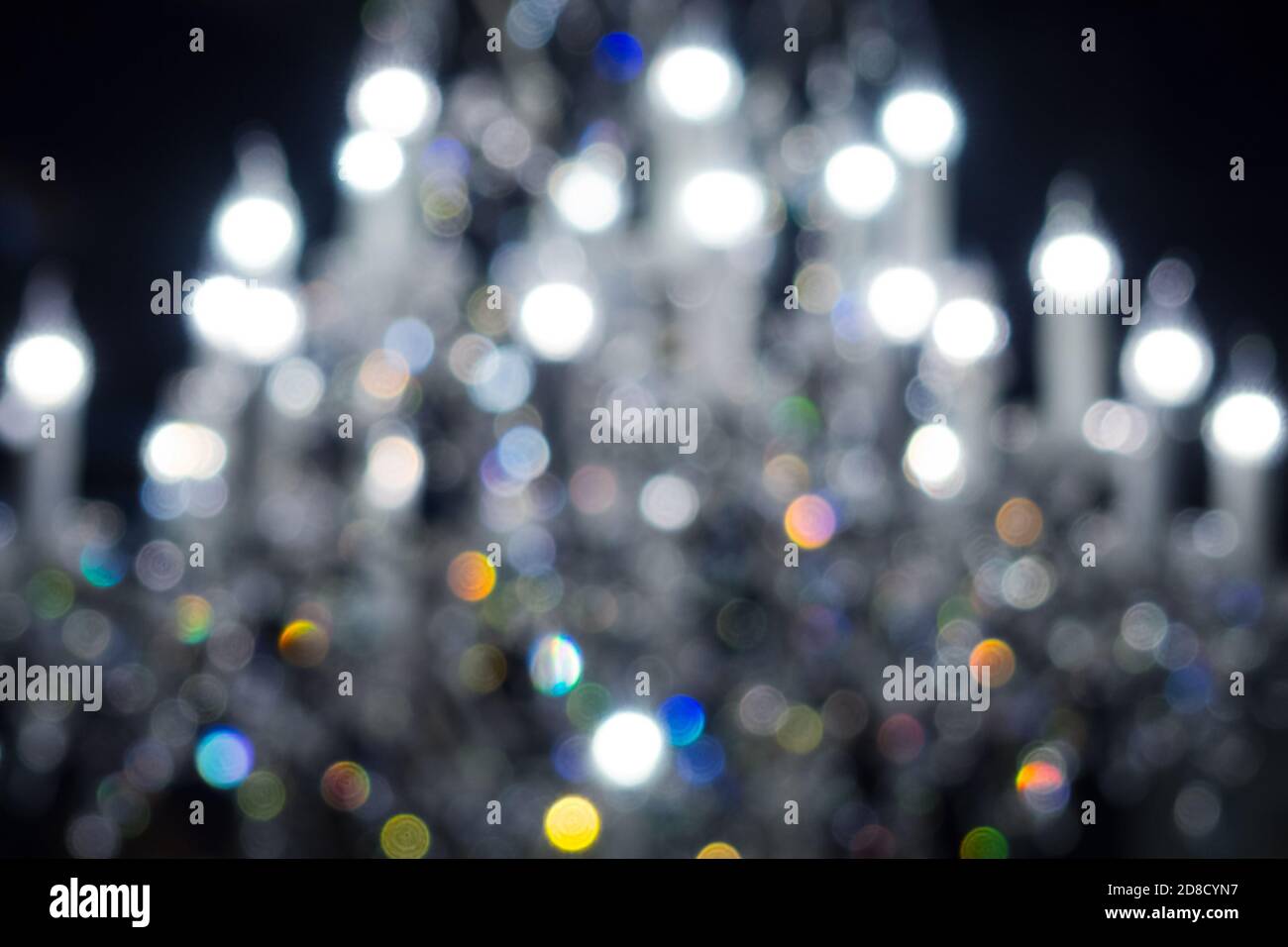 defocused lights of chandelier, blurred light fixture background Stock Photo