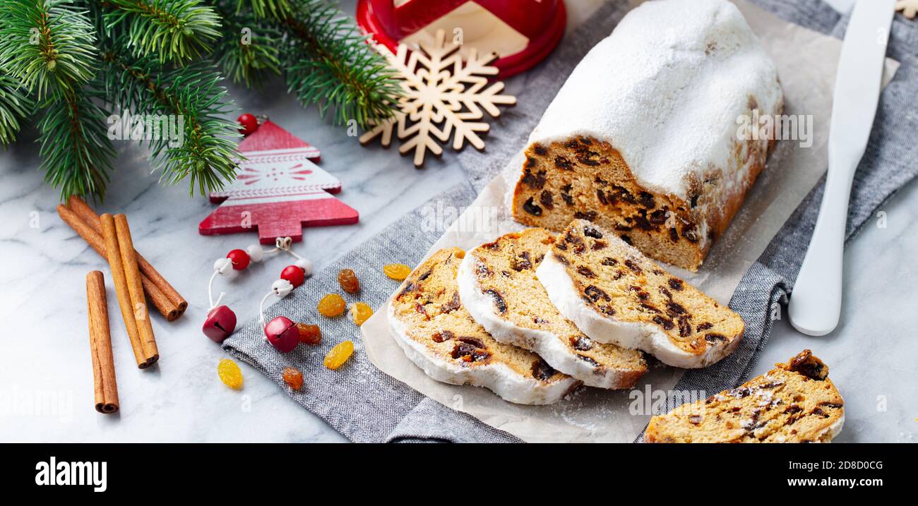 Christmas stollen. Traditional German festive dessert. Marble background. Stock Photo