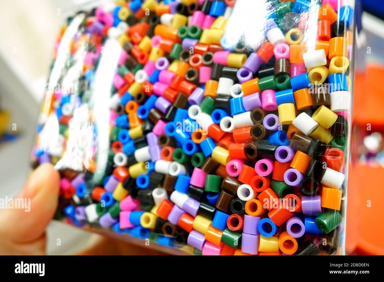 Assorted colors of Ikea Pyssla thermo-mosaic beads in a transparent  container, selective focus Stock Photo - Alamy