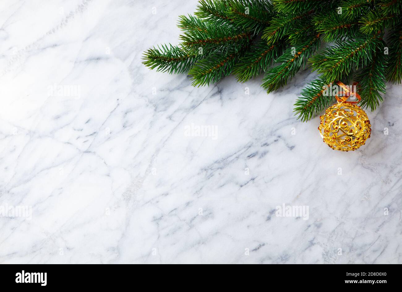 Christmas and New Year decoration, fir tree and ornaments. Marble background. Copy space. Top view. Stock Photo