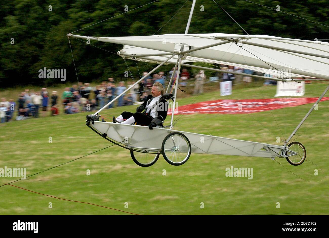 Richard Branson recreates the flight of Sir George Cayley's glider, in a replica, at Brompton, Near Scarborough, North Yorkshire. Photo by Andrew Higg Stock Photo