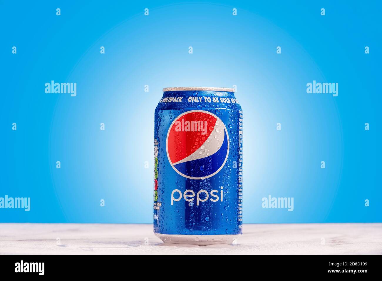 London, United Kingdom - October 29 2020:  Ice cold can of Pepsi alone with condensation on a blue background. Stock Photo