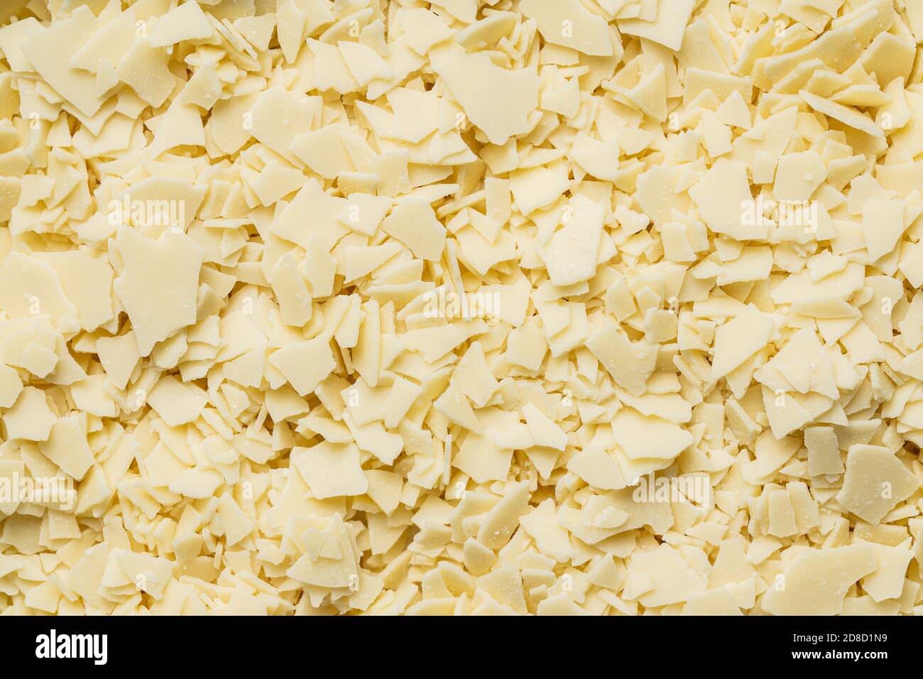 Grated white chocolate. Chocolate flakes background Stock Photo - Alamy