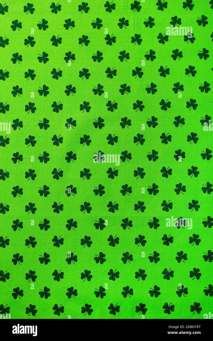 Shamrock pattern green textile. St. Patrick's Day background. Copy space. Top view. Stock Photo