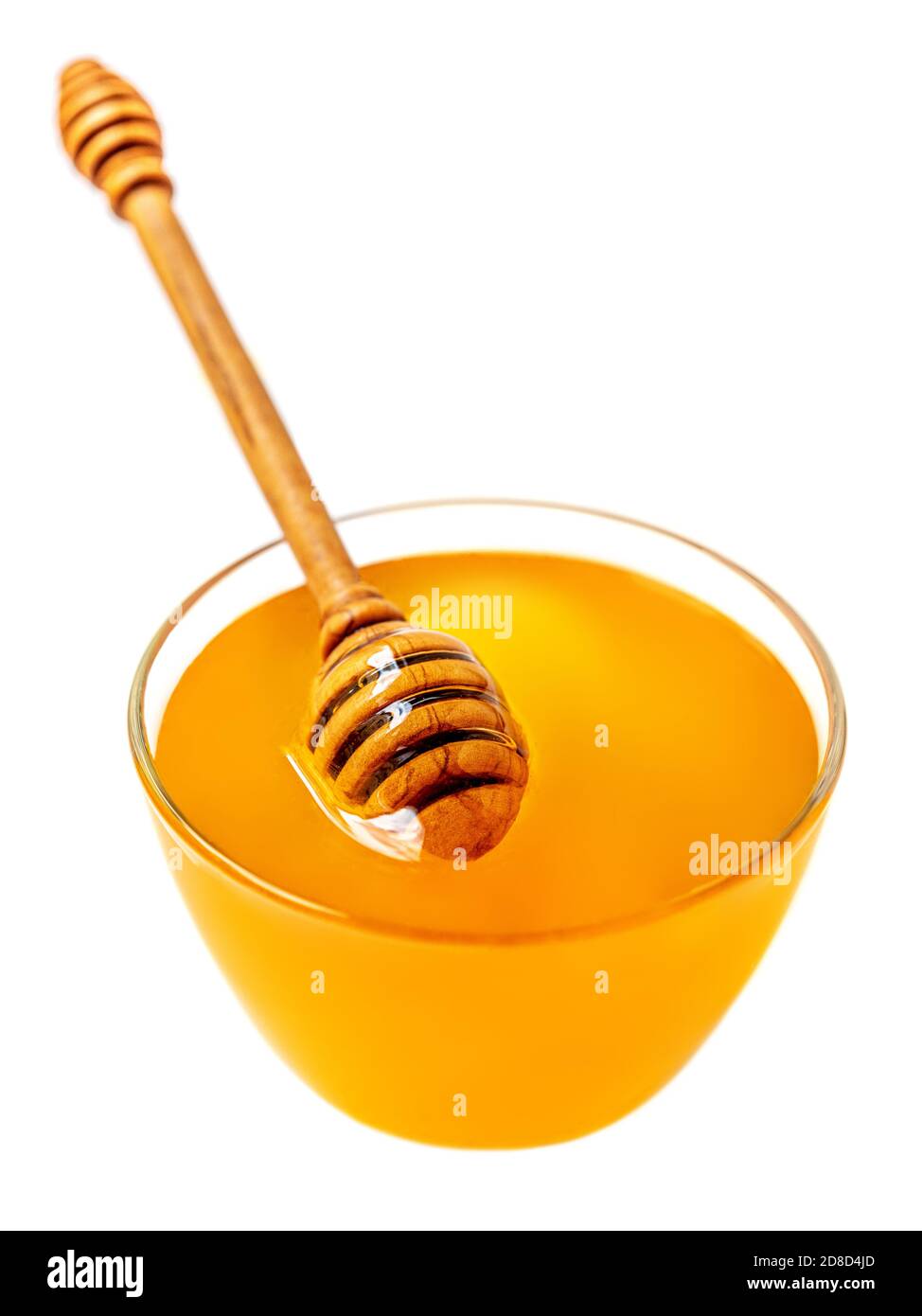 Honey dipper and honey in jar isolated on white background. Organic