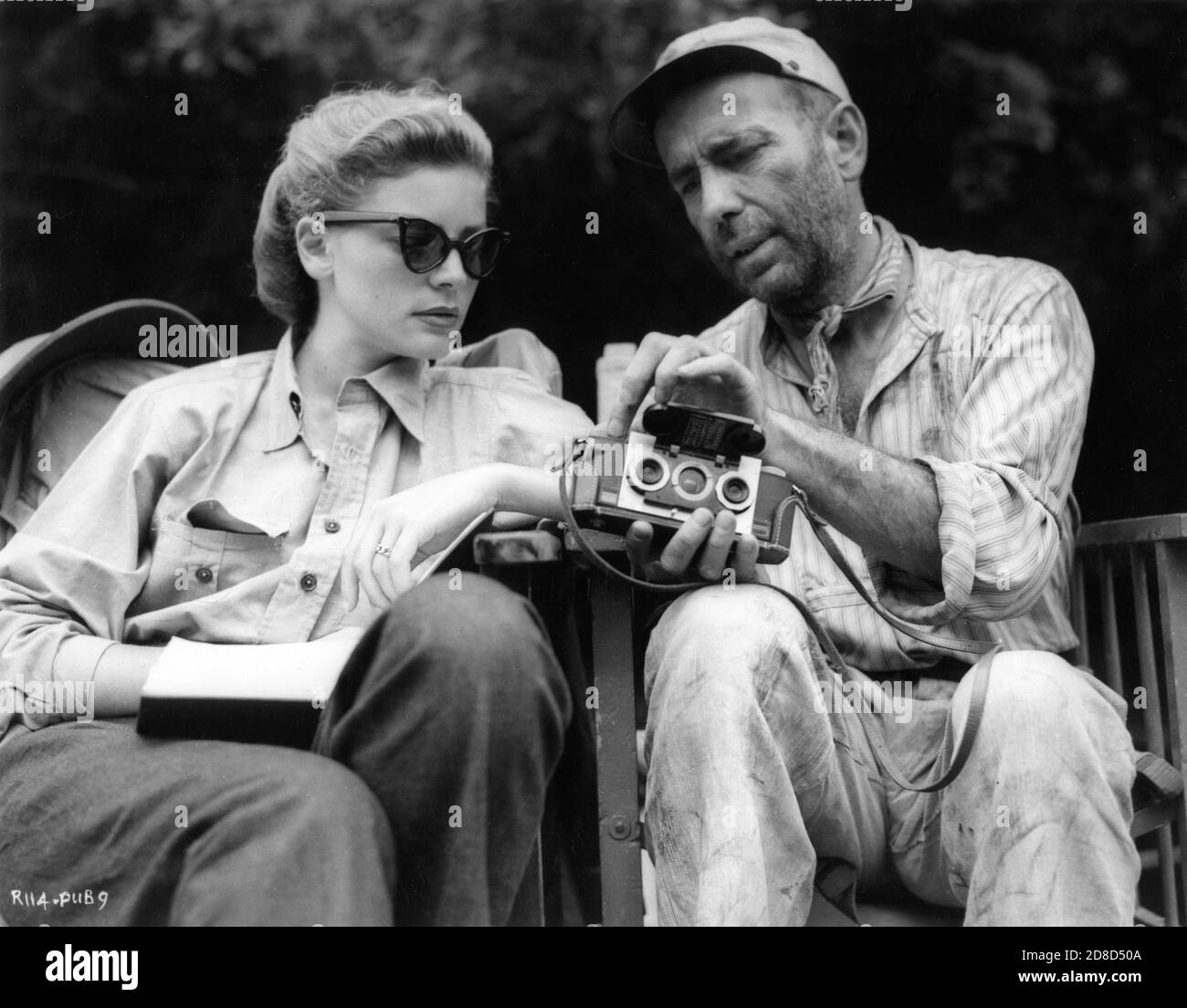 LAUREN BACALL and HUMPHREY BOGART check their 3D Camera on set location ...
