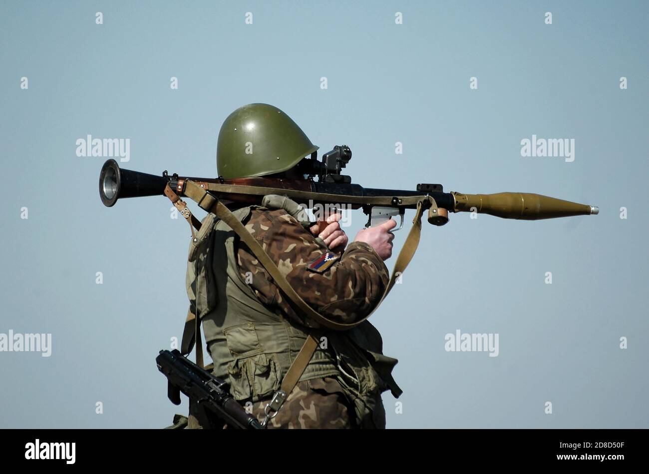 Soldier with antitank grenade launcher and flag of Artsakh and also known as Nagorno-Karabakh Republic on military uniform. Collage. Stock Photo