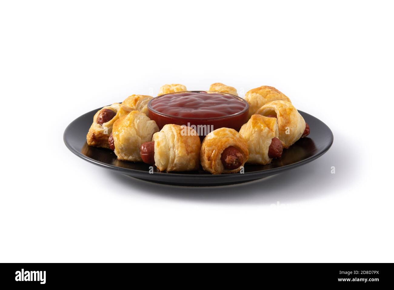 Pigs in blankets. Mini sausages wrapped in puff pastry isolated on