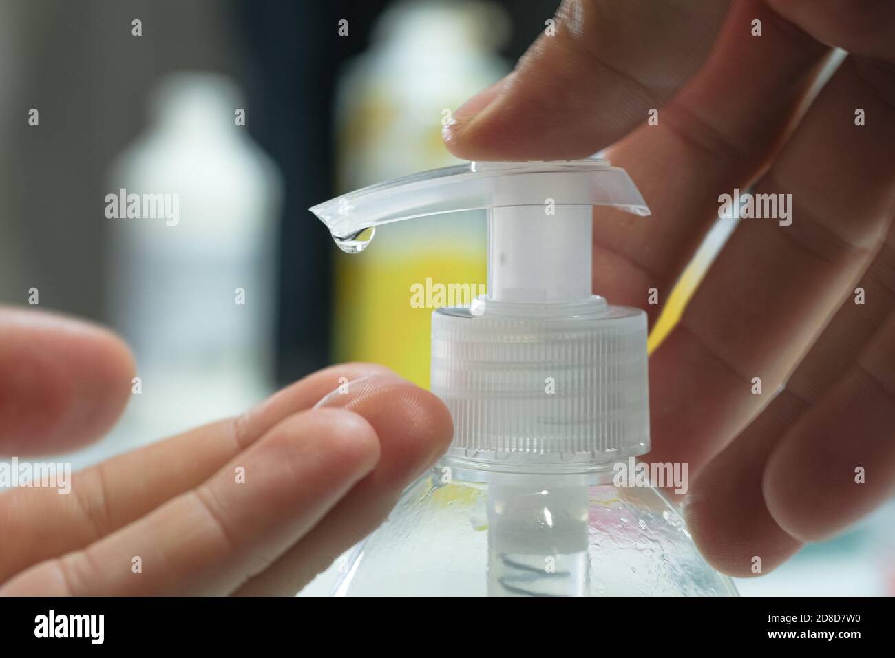 Man sanitizing hand with alcohol gel sanitizer disinfectant dispenser,corona virus covid19 pandemic disease Stock Photo