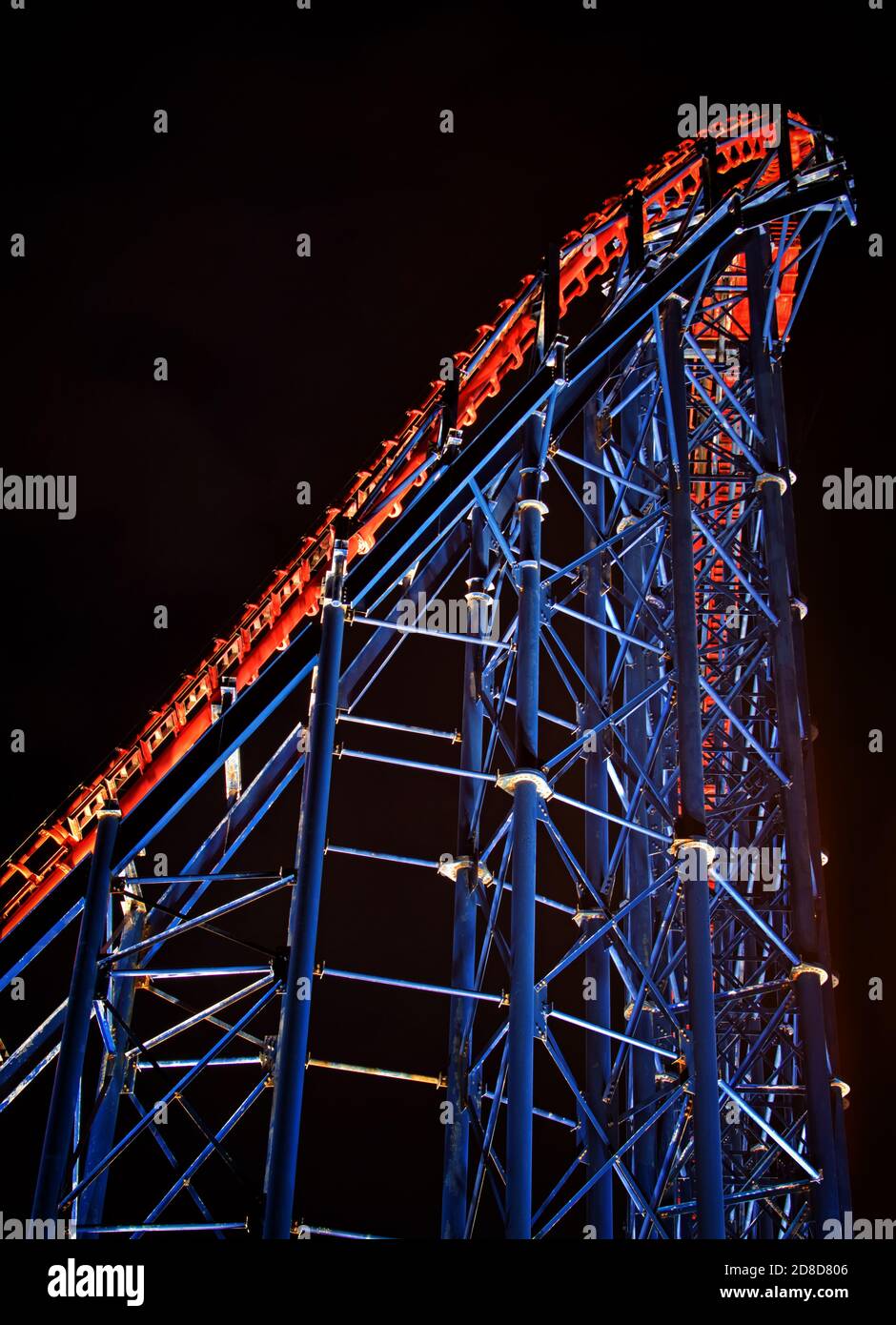An abstract view, in portrait format, of a famous attraction at Blackpool Pleasure Beach, during the illuminations Stock Photo