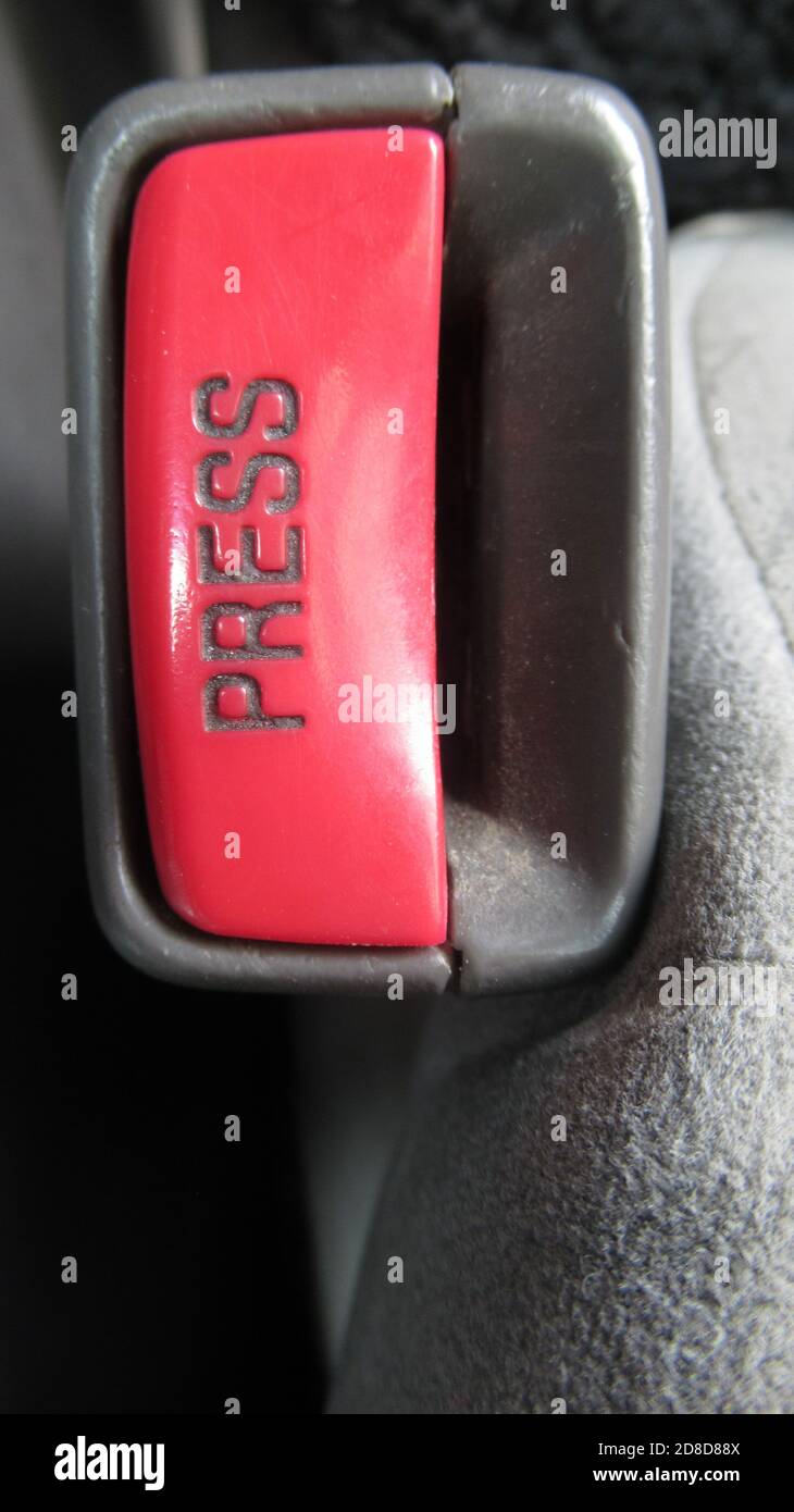 Red press seat belt button Stock Photo - Alamy