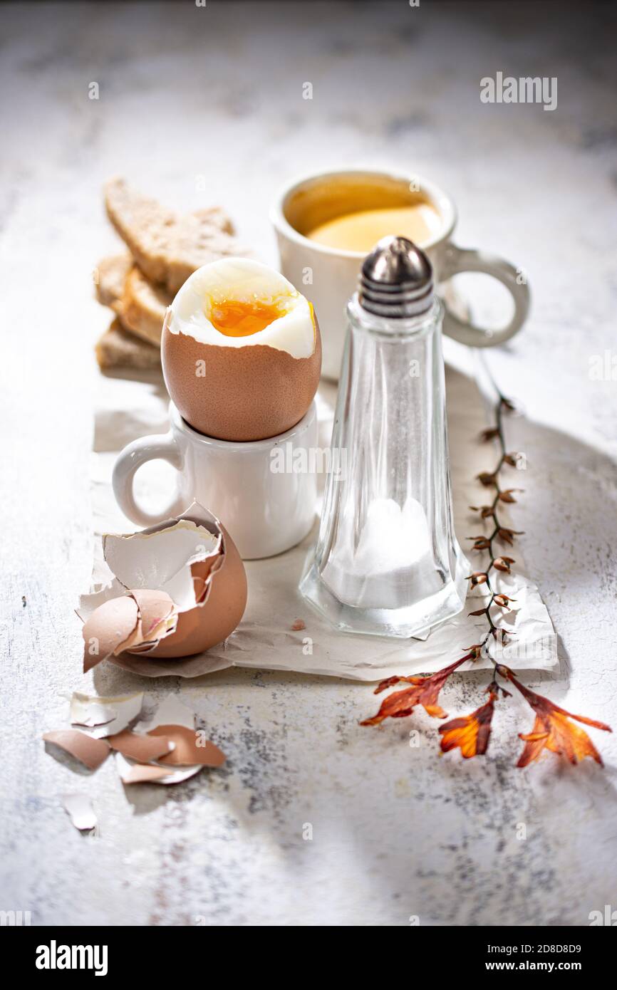 soft-boiled egg with coffee.Delicious breakfast.Healthy food and drink.Country style. Stock Photo