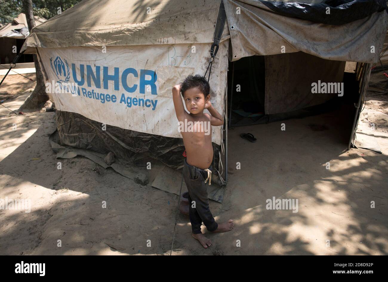 Rohingya refugee at the Kutupalong transit center . Over 650,000 Rohingya have crossed the border to Bangladesh since August last year, fleeing the violence. Stock Photo