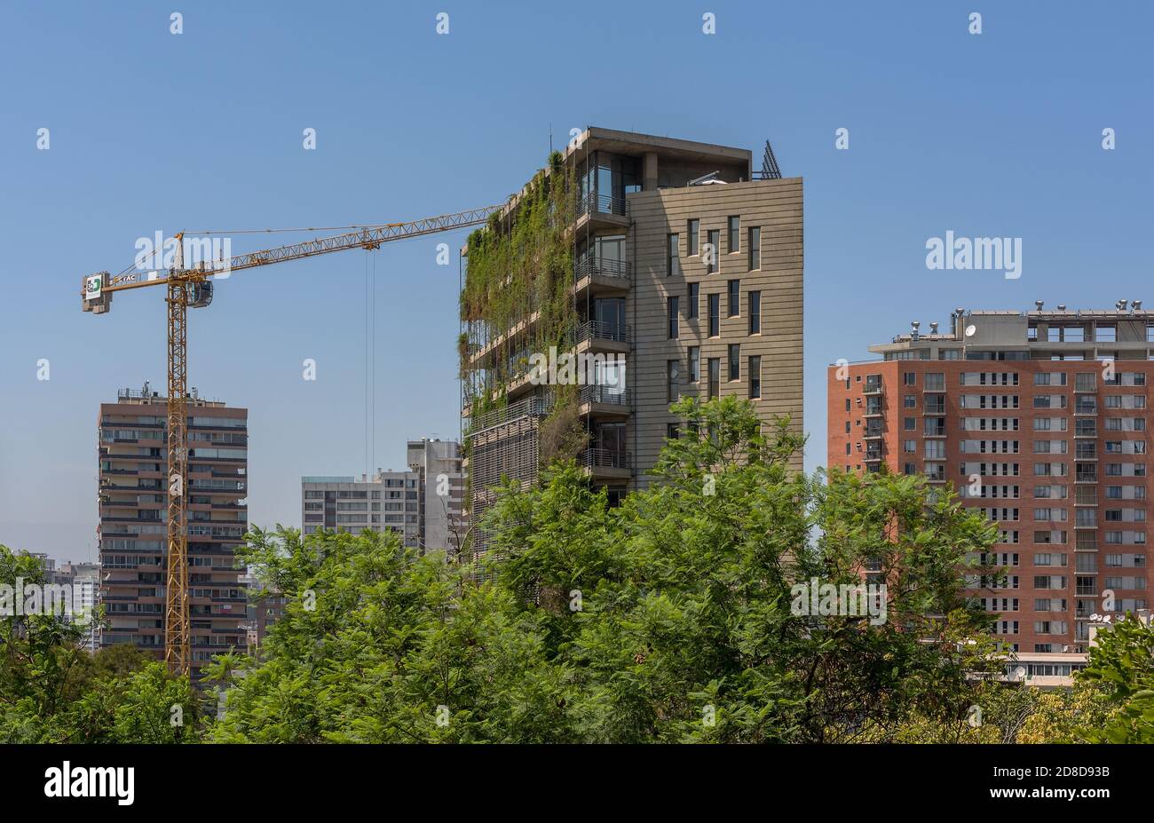 Green skyscraper building with plants growing on the facade, Santiago, Chile Stock Photo