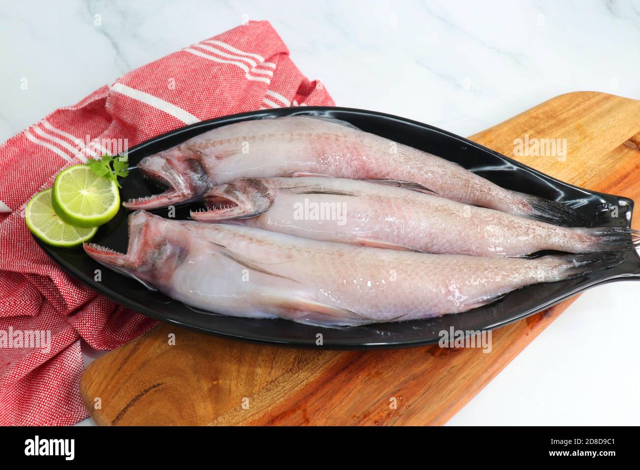 Fresh sea fish Bombay duck or Bombil and ingredients for cooking, green ...
