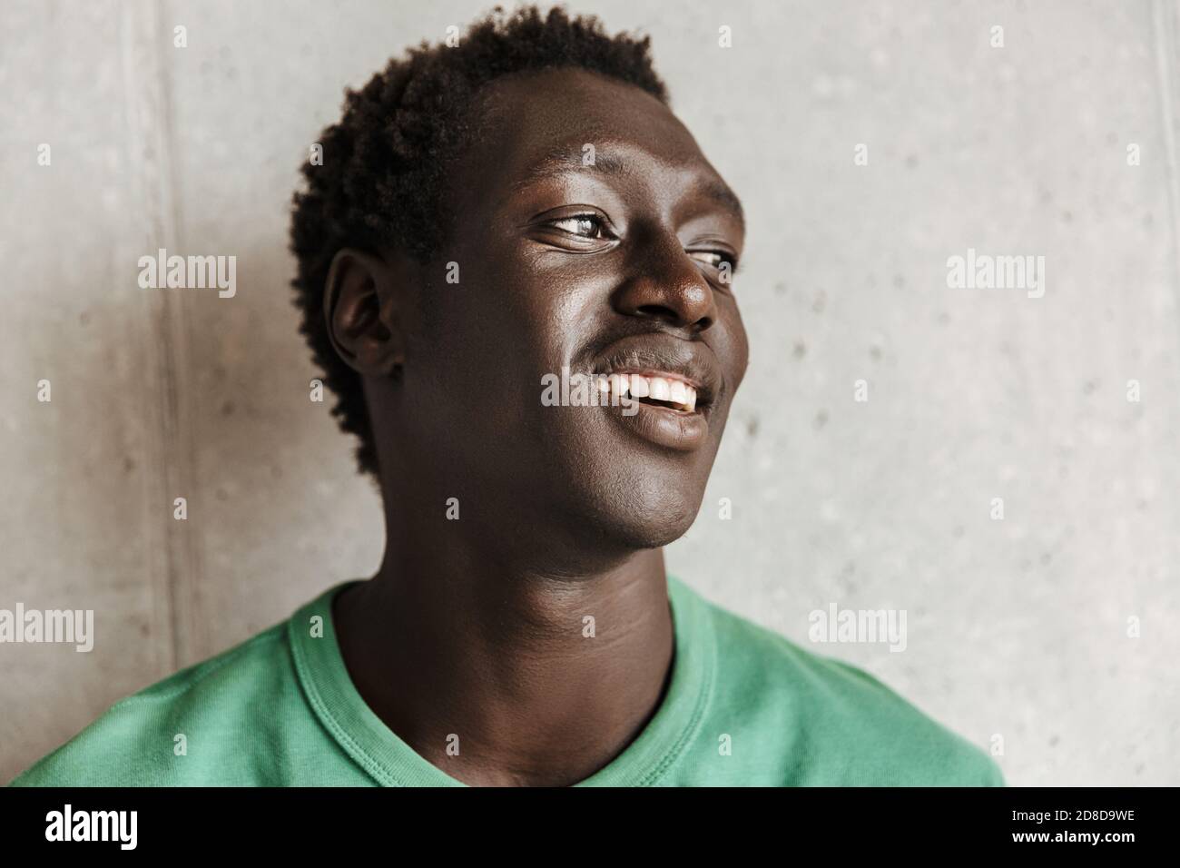 Image of attractive happy young african american man in casual clothes ...