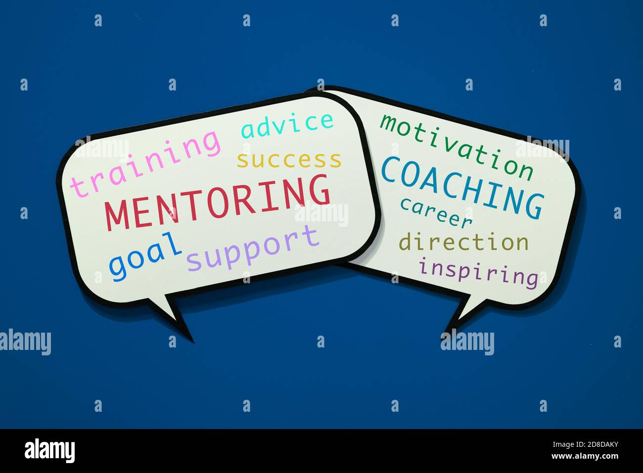 two speech balloons with some concepts related to the mentoring in a professional environment , such as training, coaching, goal, success or advice on Stock Photo