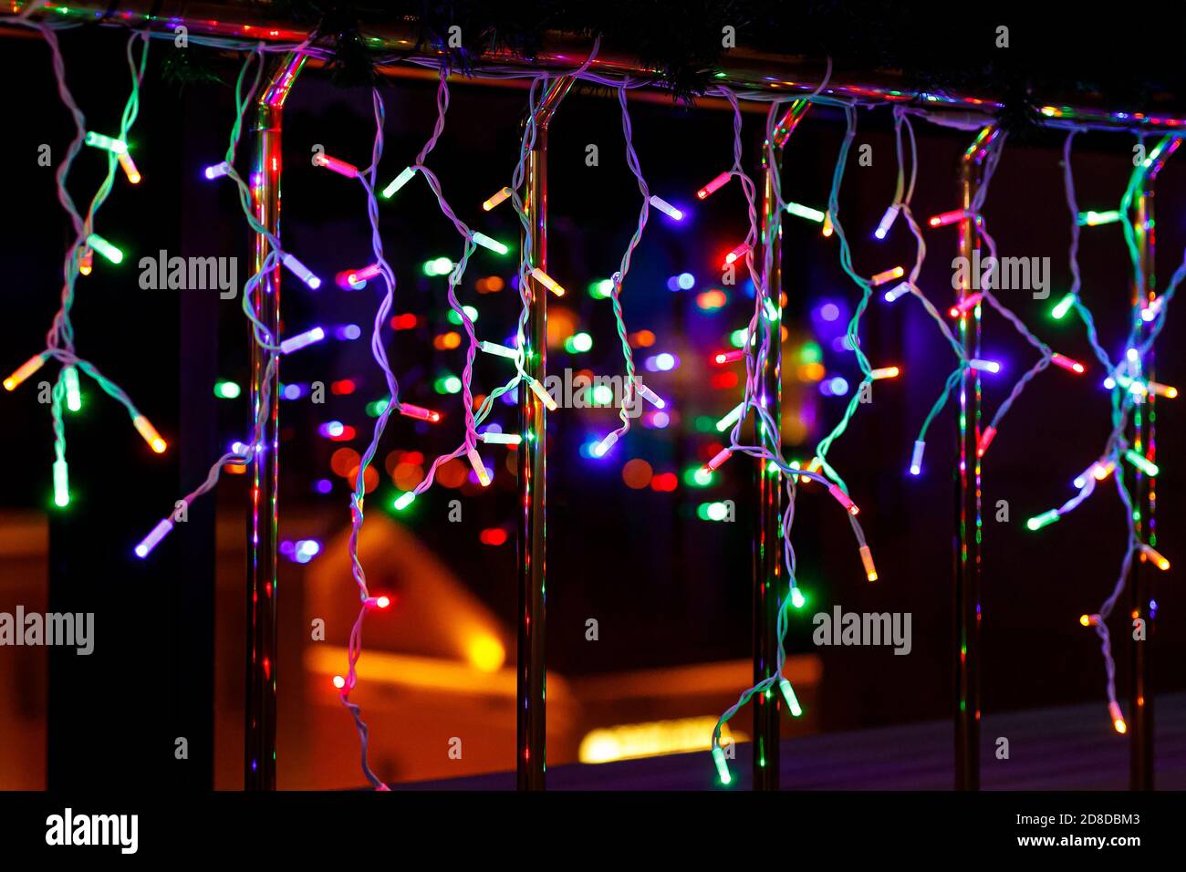 Christmas garland lights with window reflection Stock Photo Alamy