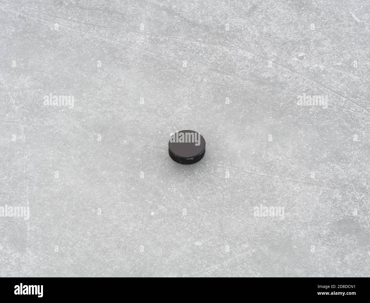 Puck on ice hockey rink surface, naturally frozen, winter sport background Stock Photo Alamy