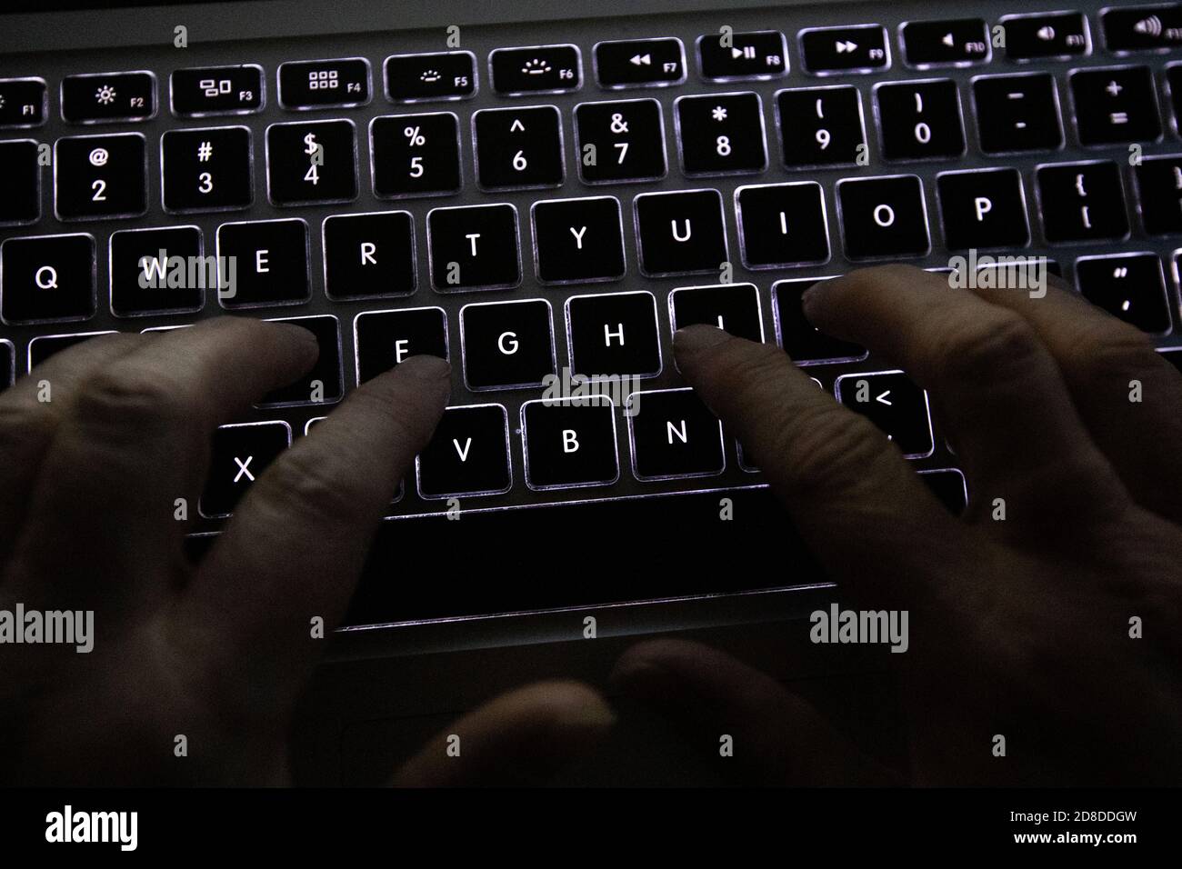 A person uses a laptop keyboard in Kingston, Ontario on Saturday, April 11, 2020. Stock Photo