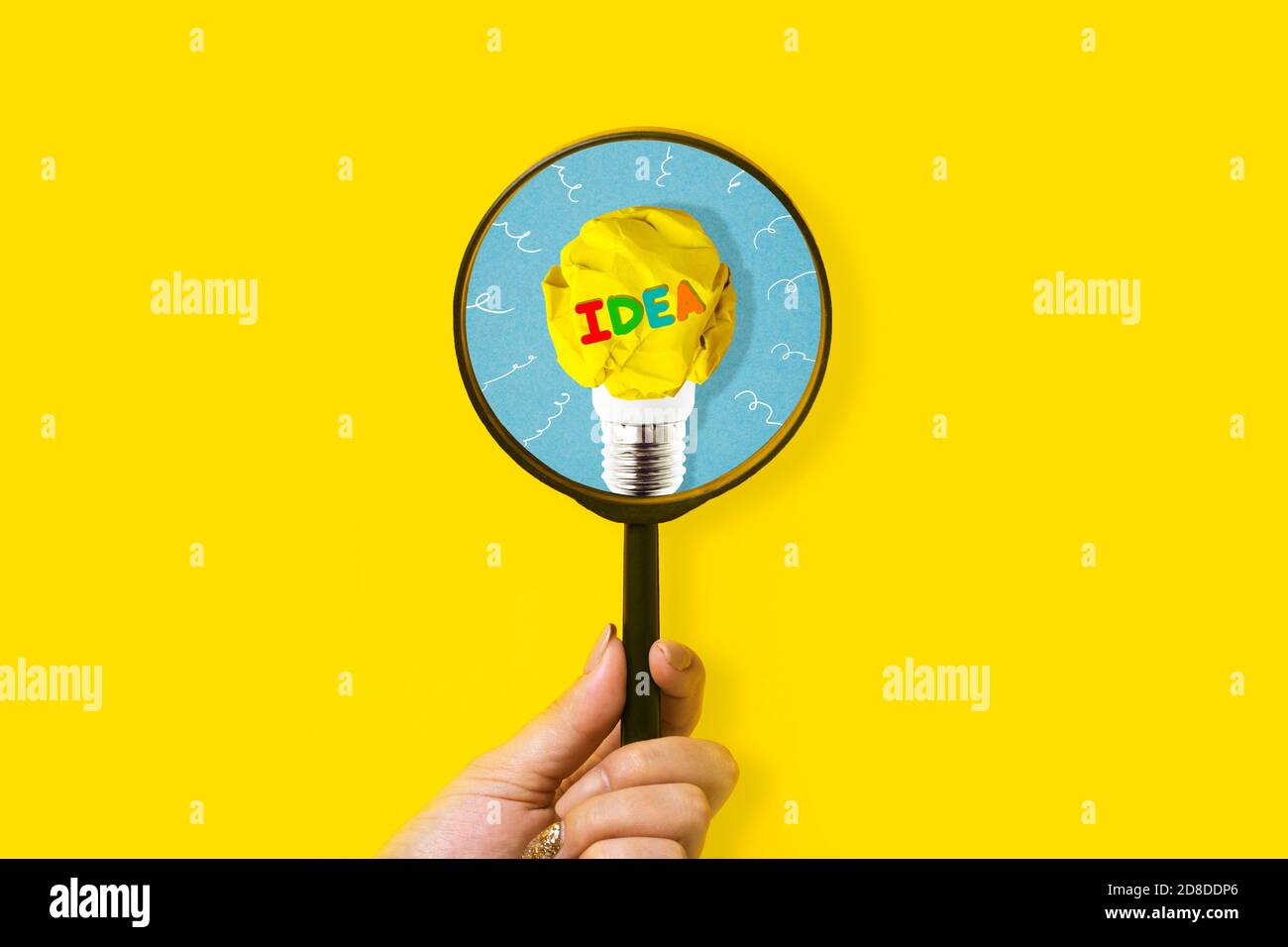 Creative Method Magnify Creative idea and innovation concept with magnifier in hand on yellow ...
