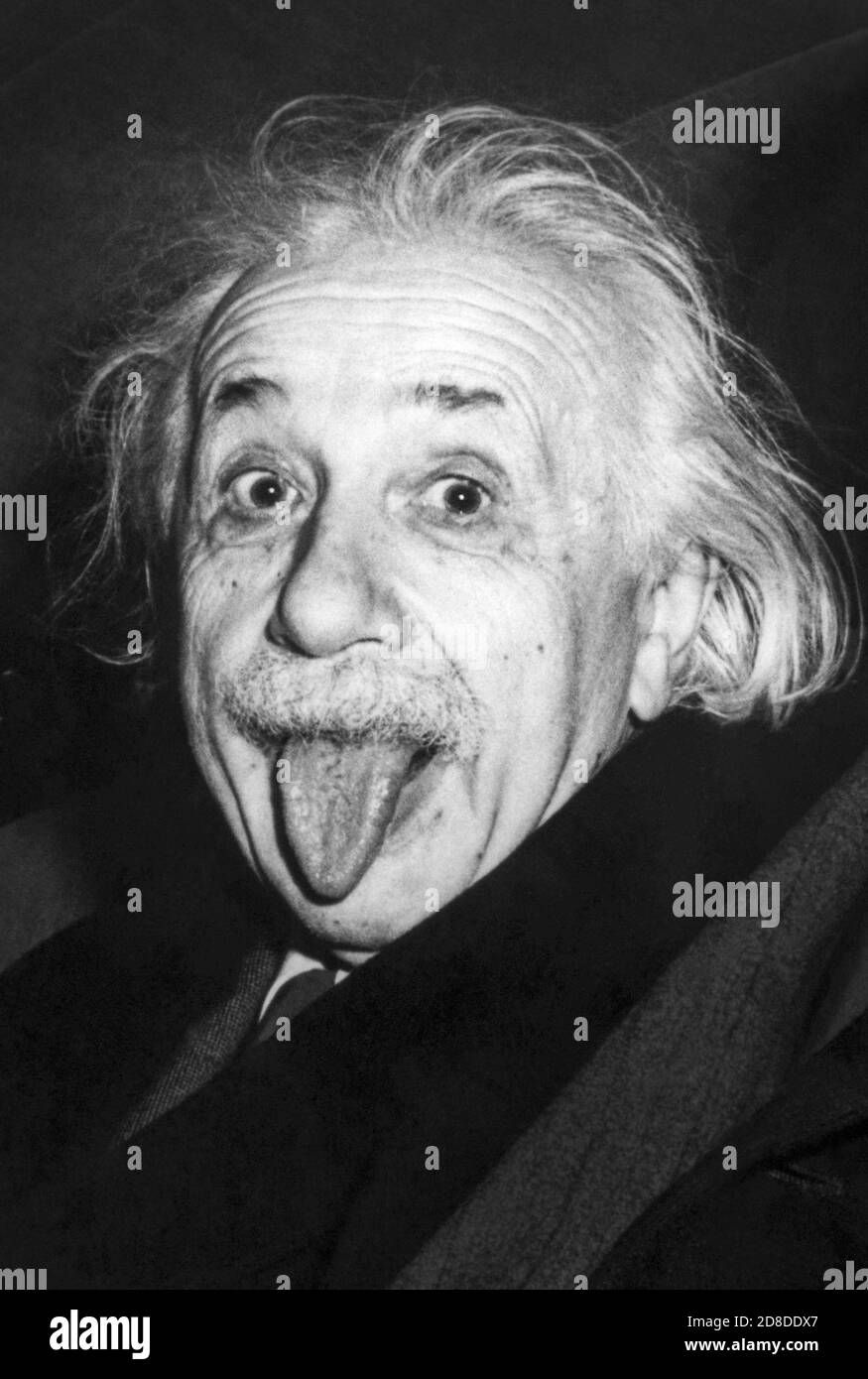 Iconic photo of Albert Einstein sticking out his tongue on the occasion of his 72nd birthday party at Princeton University on March 14, 1951. (Photo by Arthur Sasse) Stock Photo