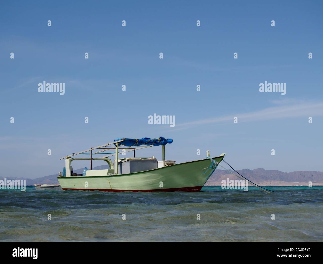 Wooden fishing boat anchored at the sea coast, Egypt Stock Photo - Alamy