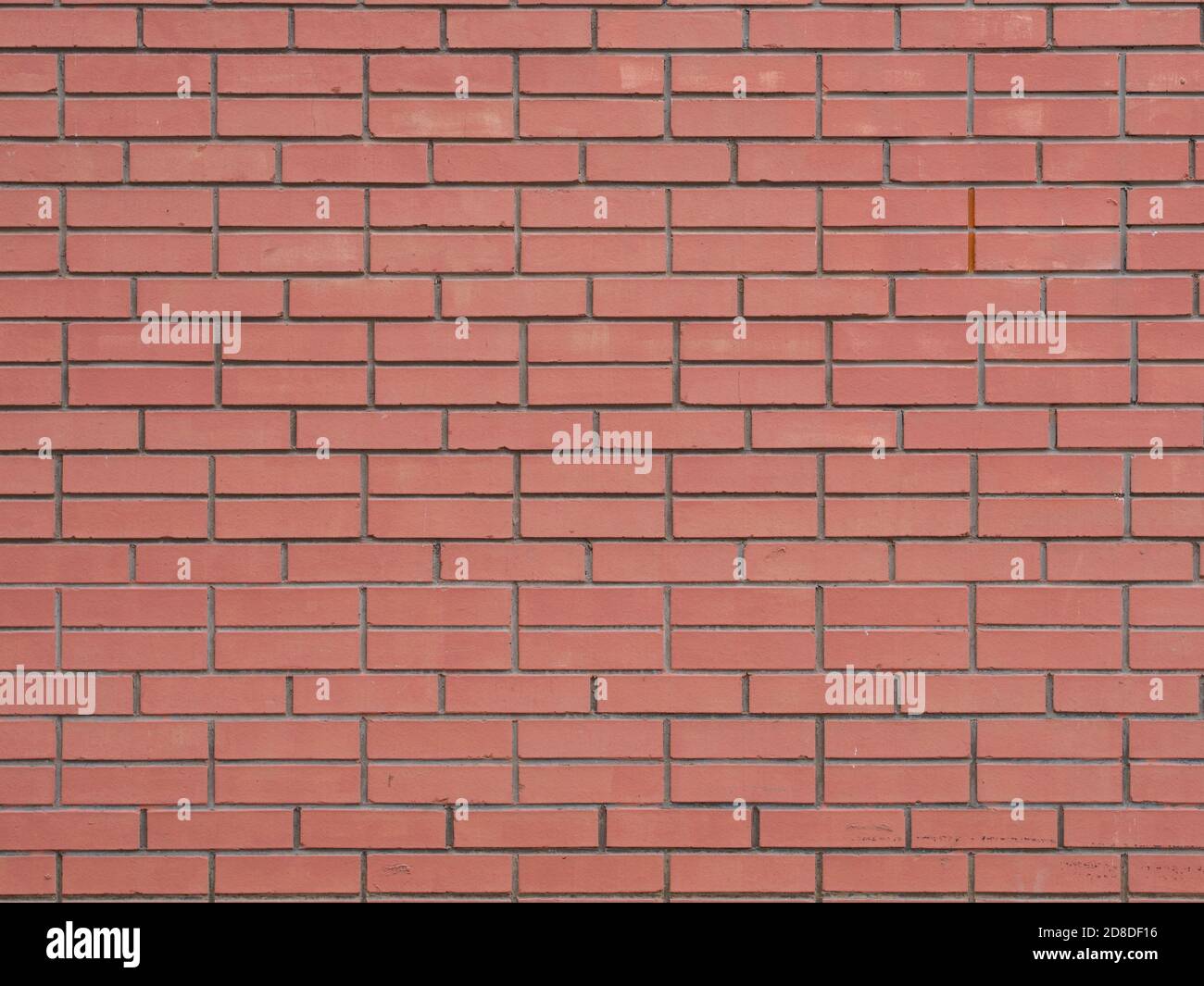 Modern artificial smooth red brick wall surface background Stock Photo