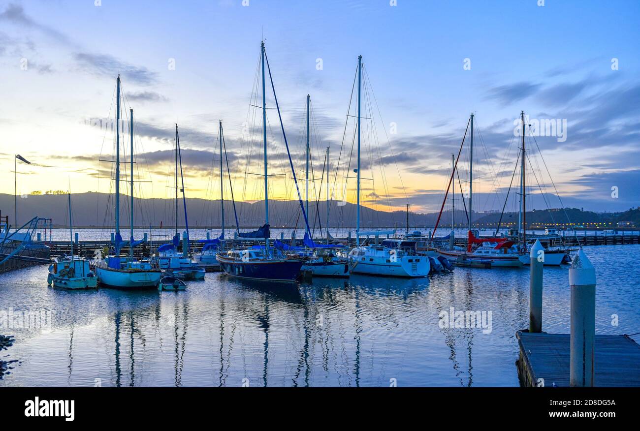 Private Boats at sunset in the Knysna Lagoon, Garden Route, South Africa Stock Photo