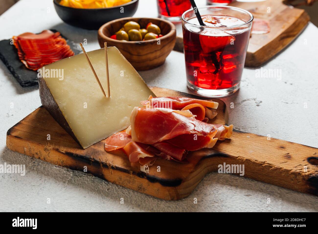 Pictures of typical Spanish food snacks (tapas). Composed of Sangria, iberian ham, manchego