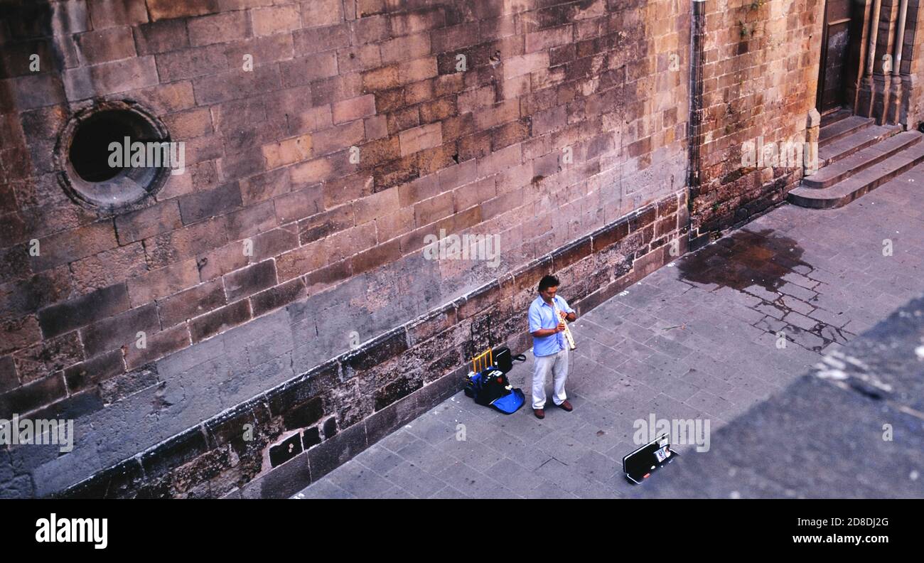 Street busker musician playing in the back streets of Barcelona. Catalan. Spain. Europe Stock Photo