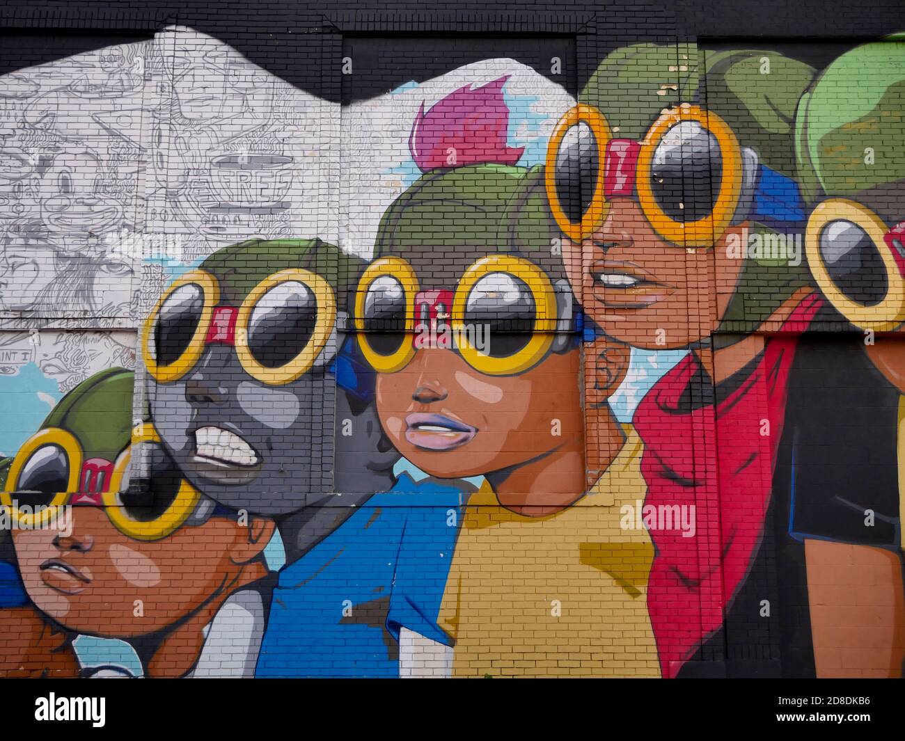 Painted mural near the Eastern Market of Detroit of children of color with googles, artist is Hebru Brantley Stock Photo