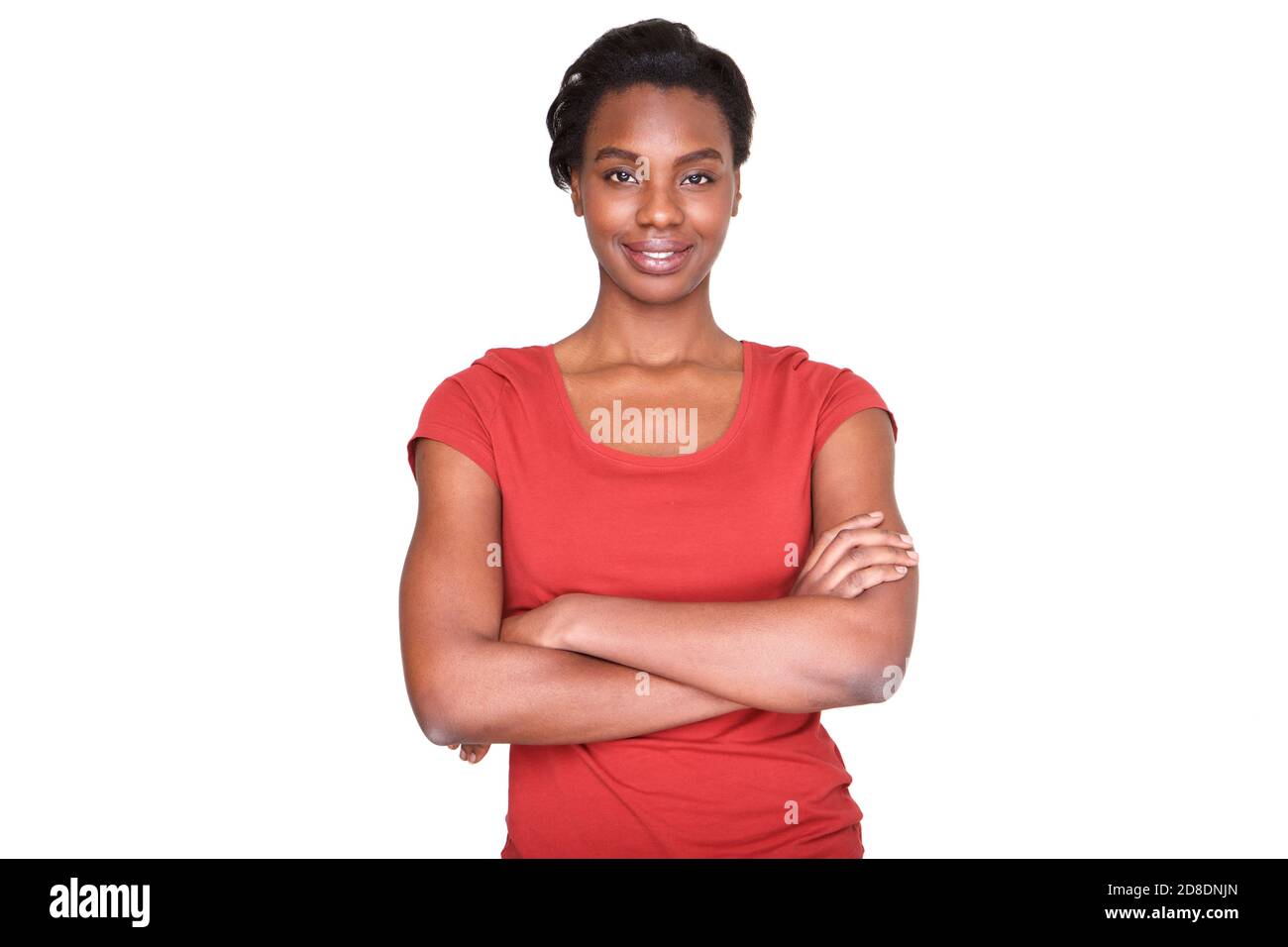 Portrait of smiling african american woman standing with arms crossed ...